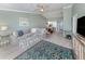 Bright and airy living room offering comfortable seating and stylish decor with views of the kitchen at 841 Waterside Dr # 202, Venice, FL 34285