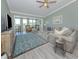 Charming living room filled with natural light, featuring a large sofa, stylish decor, and comfortable seating at 841 Waterside Dr # 202, Venice, FL 34285