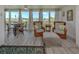 Bright living room features hardwood flooring, neutral paint and water views at 841 Waterside Dr # 202, Venice, FL 34285