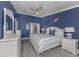 Coastal bedroom features hardwood flooring, an ensuite bathroom and walk in closet at 841 Waterside Dr # 202, Venice, FL 34285