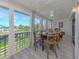Enclosed sunroom with dining and seating area with great views at 841 Waterside Dr # 202, Venice, FL 34285