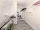 Bright walk-in closet with multiple shelves, a large mirror and wood-look flooring at 841 Waterside Dr # 202, Venice, FL 34285