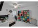 Bedroom with a colorful storage unit, tile floors, and ceiling fan at 903 E Shannon Ct, Venice, FL 34293