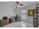 Bedroom featuring an office desk, a modern ceiling fan, and tile flooring at 903 E Shannon Ct, Venice, FL 34293