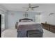 Bedroom featuring a gray bed, tile floors, and access to the backyard pool at 903 E Shannon Ct, Venice, FL 34293