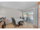 Cozy dining area with a table and chairs near sliding doors to the outdoor patio at 903 E Shannon Ct, Venice, FL 34293