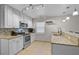 Bright kitchen featuring granite countertops, stainless steel appliances, and ample cabinet space at 903 E Shannon Ct, Venice, FL 34293