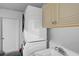 Laundry room featuring a stacked washer and dryer at 903 E Shannon Ct, Venice, FL 34293