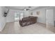 Inviting living room featuring tiled floors, a ceiling fan, and sliding glass doors to the pool at 903 E Shannon Ct, Venice, FL 34293