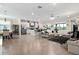 Open-concept living space featuring tile floors and a seamless flow into the kitchen and dining areas at 935 Tidewater Shores # 721, Bradenton, FL 34208