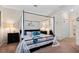Spacious main bedroom suite with a four poster bed and stylish decor at 935 Tidewater Shores # 721, Bradenton, FL 34208