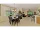 The dining room offers ample natural light with views to the living room and access to the kitchen at 9361 Carnaby Dr, Venice, FL 34293