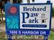 Brohard Paw Park sign on a beautiful day, featuring a welcome message for dogs at 9361 Carnaby Dr, Venice, FL 34293