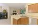 Open concept kitchen with stainless appliances overlooks living area at 9361 Carnaby Dr, Venice, FL 34293