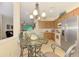 Eat-in kitchen area with stainless steel appliances, lots of cabinet space at 9361 Carnaby Dr, Venice, FL 34293