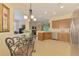 Open kitchen with stainless steel appliances, breakfast nook, and lots of cabinet space at 9361 Carnaby Dr, Venice, FL 34293