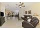 Open-concept living room showcases a cozy seating area, modern furnishings, and seamless flow to other living spaces at 9361 Carnaby Dr, Venice, FL 34293