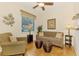 Cozy living room features natural light, comfortable furniture, and stylish decor at 9361 Carnaby Dr, Venice, FL 34293