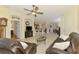 Bright open-concept living room with view of kitchen, breakfast bar, and comfortable seating arrangement at 9361 Carnaby Dr, Venice, FL 34293