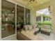 Relaxing outdoor patio with comfortable seating and views of the home's backyard at 9361 Carnaby Dr, Venice, FL 34293
