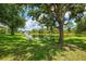 Picturesque view of the pond and surrounding greenery, offering a peaceful outdoor ambiance at 9361 Carnaby Dr, Venice, FL 34293