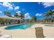 Enjoy this community pool with spa, lounge chairs, clubhouse and clear skies at 9361 Carnaby Dr, Venice, FL 34293