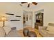 Cozy sitting room area offering comfortable seating and decorative shelves at 9361 Carnaby Dr, Venice, FL 34293