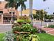 Street view of Venice downtown featuring a decorative flower pot, buildings, and sidewalks at 9361 Carnaby Dr, Venice, FL 34293