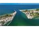 Aerial view of inlet leading to Gulf, showcasing beaches and waterfront homes at 950 Tarpon Center Dr # 305, Venice, FL 34285