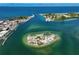 Beautiful aerial view showing a small island and the ocean inlet at 950 Tarpon Center Dr # 305, Venice, FL 34285