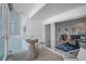 Balcony with seating and a view through sliding glass doors to the living room at 950 Tarpon Center Dr # 305, Venice, FL 34285