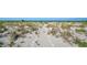 A beach access path shows natural dunes and vegetation along the path at 950 Tarpon Center Dr # 305, Venice, FL 34285
