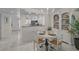 Dining area with chandelier next to kitchen and ocean view at 950 Tarpon Center Dr # 305, Venice, FL 34285