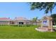 Venice Art Center featuring beautiful landscaping, tile roofing and vibrant flags at 950 Tarpon Center Dr # 305, Venice, FL 34285