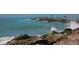 Picturesque waterfront scene with people fishing on the pier and waves crashing at 950 Tarpon Center Dr # 305, Venice, FL 34285