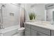 Stylish bathroom with a shower and tub, vanity with a sink, and modern fixtures at 121 Colebrook Ct, Venice, FL 34292