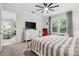 Bedroom featuring a large window and a comfortable bed at 121 Colebrook Ct, Venice, FL 34292