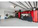 Spacious garage with epoxy floors and ample storage, ideal for hobbies and projects at 121 Colebrook Ct, Venice, FL 34292