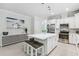 Bright and open kitchen with a large island, stainless steel appliances, and modern decor at 121 Colebrook Ct, Venice, FL 34292