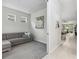Comfortable living room with grey sofa and an open view of the kitchen and dining area at 121 Colebrook Ct, Venice, FL 34292