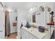 Bright bathroom featuring a spacious vanity, modern fixtures, and a walk-in shower at 1222 Pinebrook Way, Venice, FL 34285