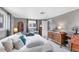 Comfortable bedroom features plush bedding, ample closet space, and a serene ambiance at 1222 Pinebrook Way, Venice, FL 34285