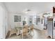 Cozy dining room with lots of natural light and wicker chairs at 1222 Pinebrook Way, Venice, FL 34285