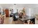 Seamless kitchen and living room space with an island with seating at 1222 Pinebrook Way, Venice, FL 34285