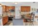 Well-equipped kitchen featuring stainless steel appliances and a breakfast bar with seating at 1222 Pinebrook Way, Venice, FL 34285