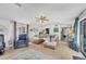 Spacious living room with tile flooring, comfortable seating, and abundant natural light at 1222 Pinebrook Way, Venice, FL 34285