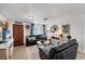 Inviting living room featuring a plush sofa, stylish decor, and warm natural light at 1222 Pinebrook Way, Venice, FL 34285