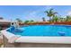 Sparkling above-ground pool, perfect for summer fun and relaxation under the clear blue sky at 1222 Pinebrook Way, Venice, FL 34285