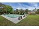 Community shuffleboard courts with benches, offering a relaxing recreational activity for residents at 1222 Pinebrook Way, Venice, FL 34285