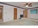 Cozy bedroom features neutral walls, carpet, ceiling fan, and access to an ensuite bathroom at 1290 Leeward Rd, Venice, FL 34293